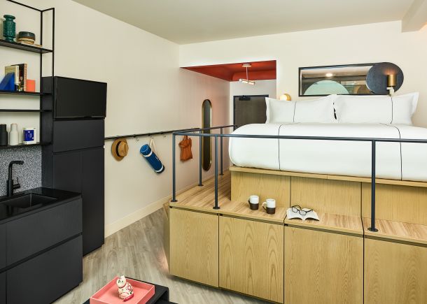 Catbird suite with red ceiling accent and kitchenette