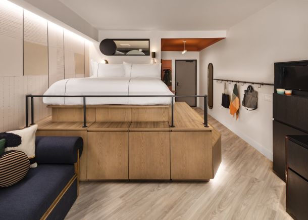 Catbird Micro Studio with elevated bed and textured wall panels