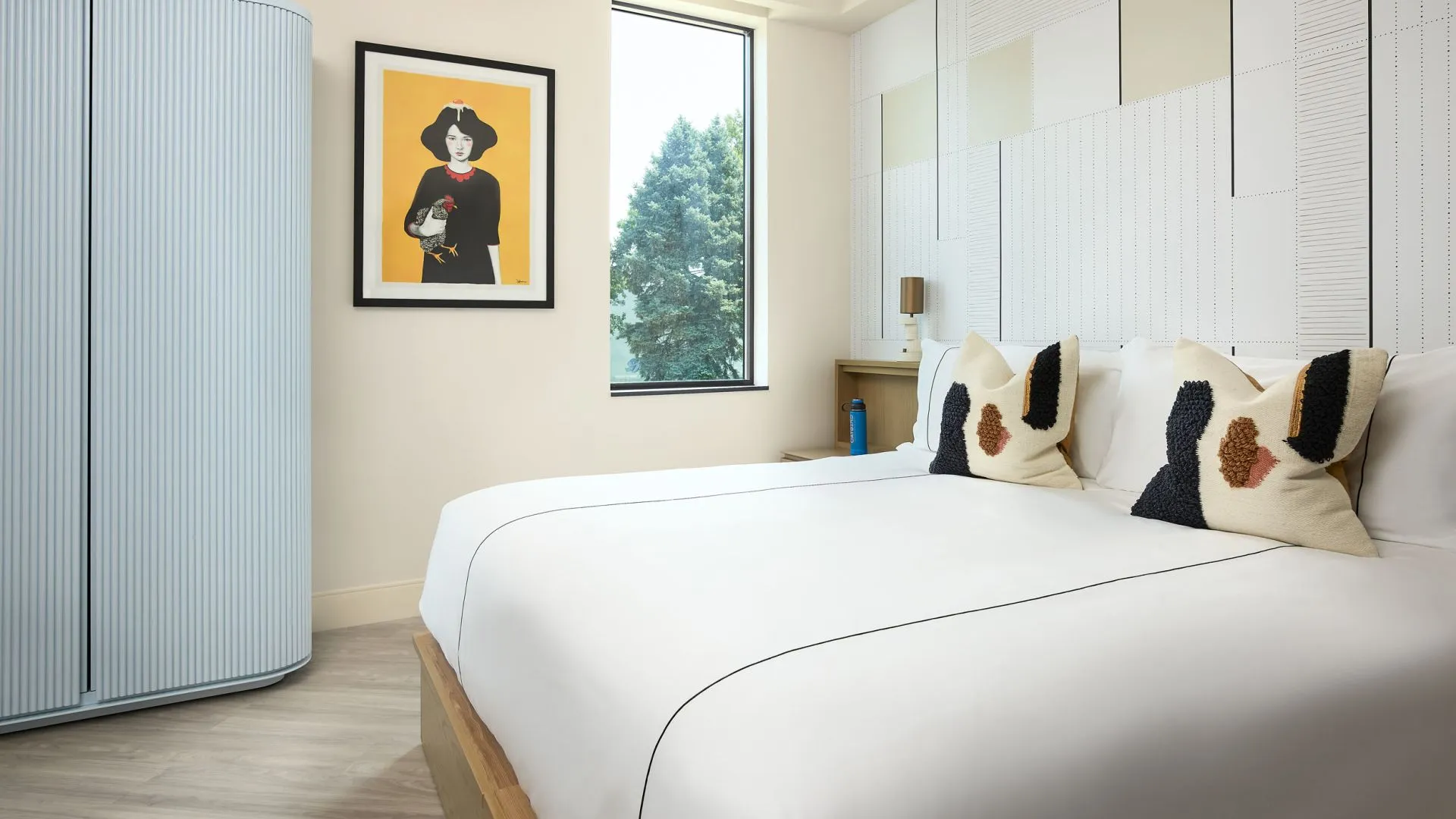 Catbird Hotel suite with lofted bed and projector